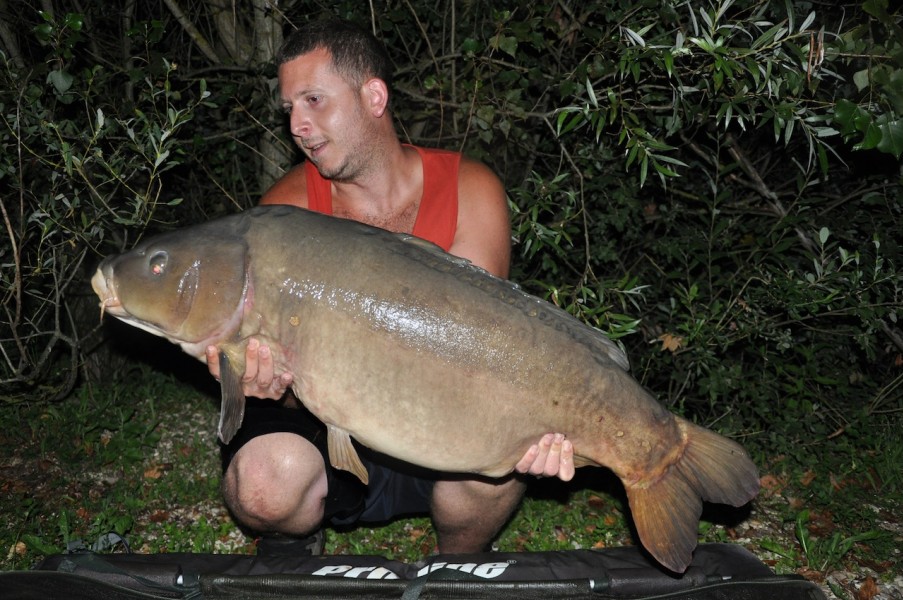 Brad with "the nude fish" 42.11lb stock pond July 2013