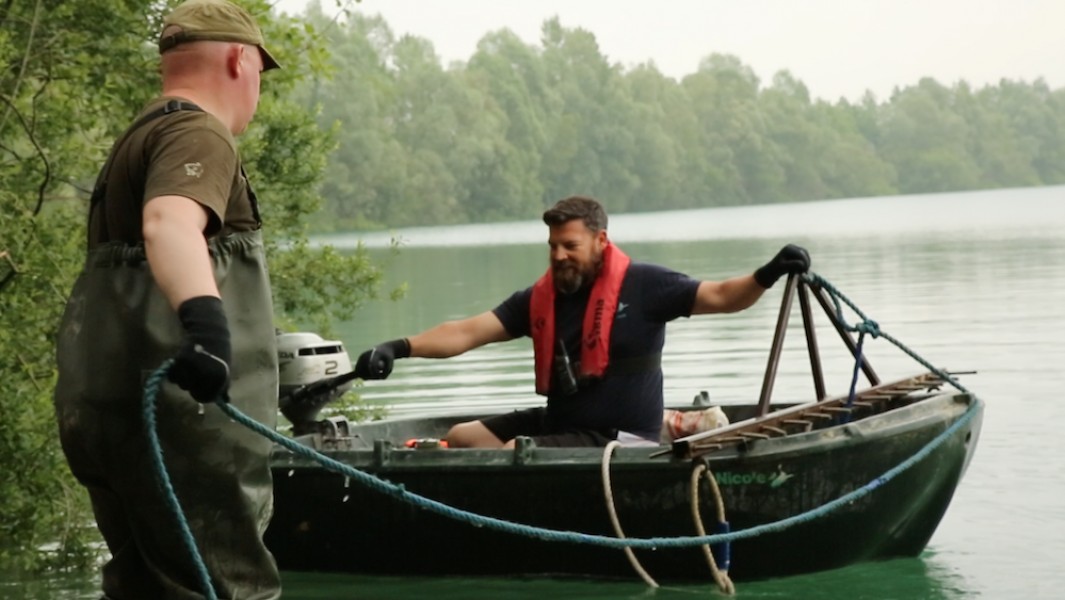 Rich helping Buzz with the boat