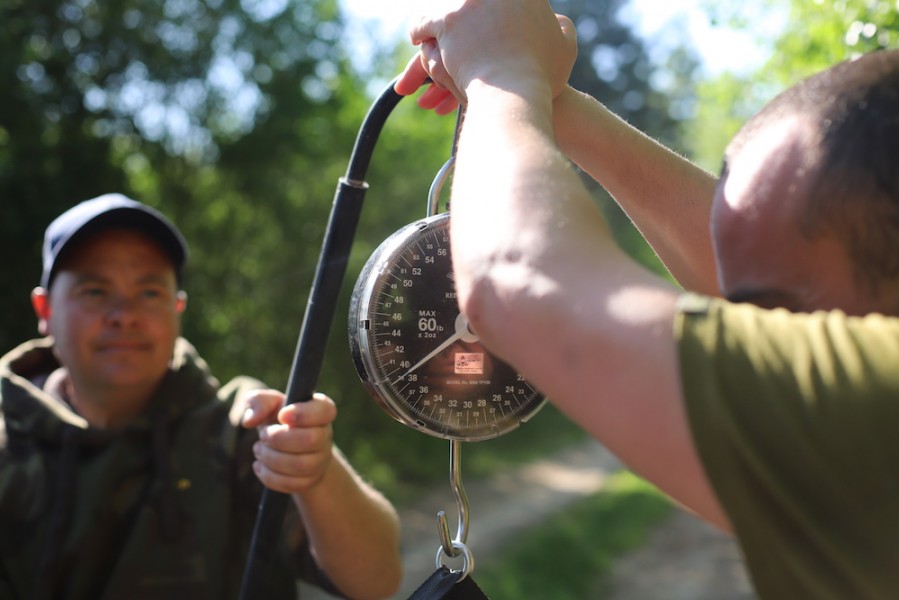 Richard and Andy weighing one of his fish