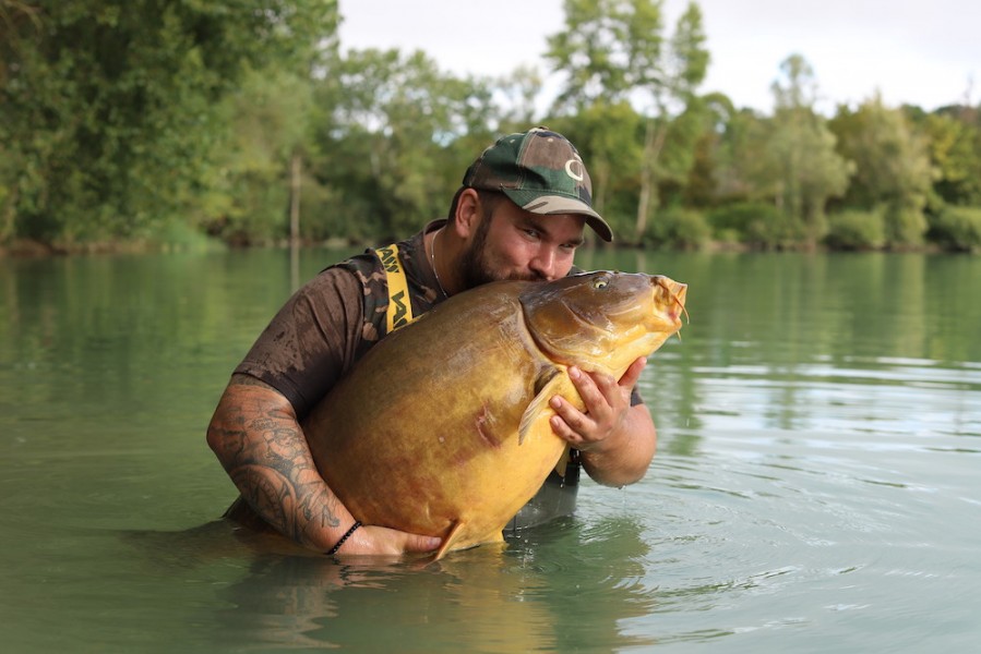 Dan cuddling his new pb.