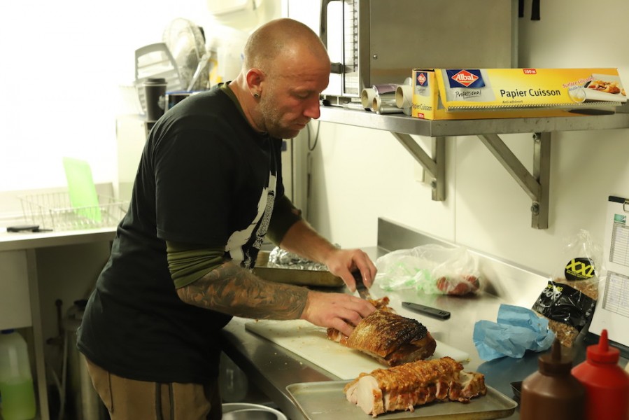 Chef Simon carving up the pork.