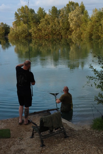 Jason helping Tom land his fish
